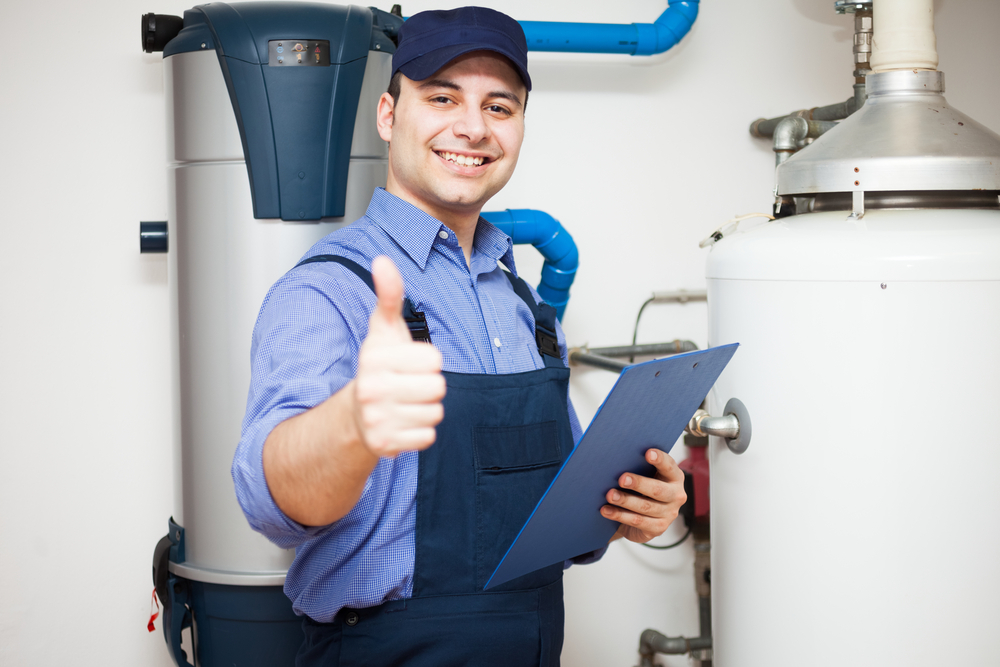 Smiling Technician Servicing hot water heater